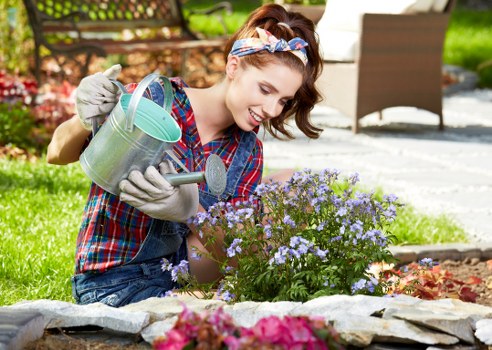 Team handling recyclable green waste and reusable landscaping materials